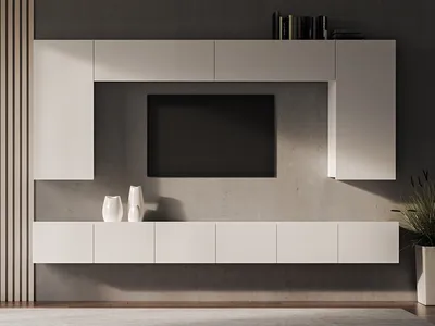 A modern white media console with a television mounted above it, set against a dark gray wall.