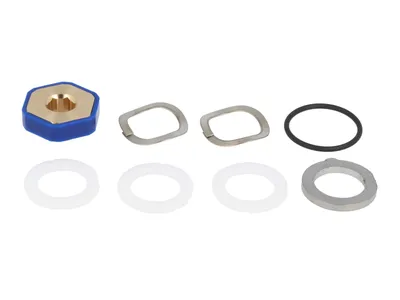 A collection of plumbing parts, including a blue and gold hexagonal fitting, several metal washers, white rubber gaskets, and a black O-ring, arranged on a white background.