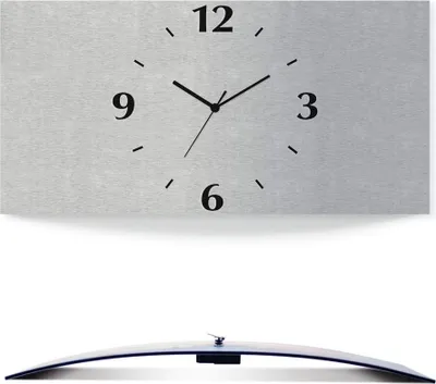 A modern, curved wall clock with a silver-toned face and black hands and numbers.