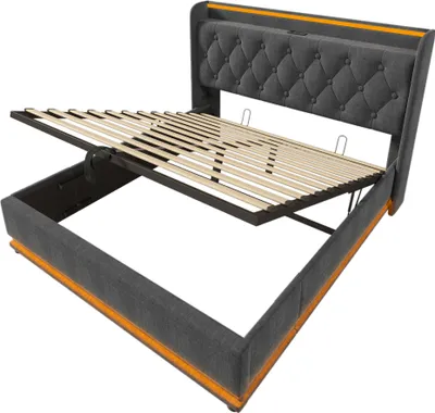 A bed frame with the mattress support mechanism lifted to reveal storage space underneath.