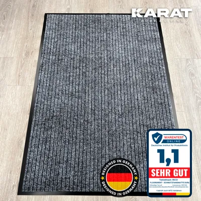 A doormat on a wooden floor.