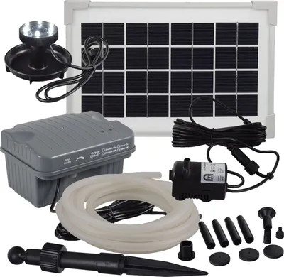 A collection of solar-powered water pump components, including a solar panel, pump, tubing, and LED light, laid out on a white background.