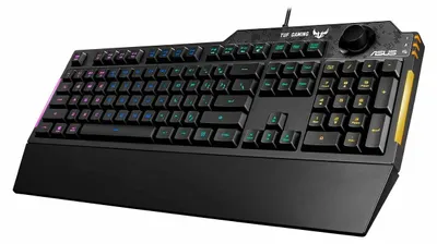 A black Asus TUF Gaming K1 keyboard with RGB lighting and yellow accents, shown from a diagonal angle on a white background.
