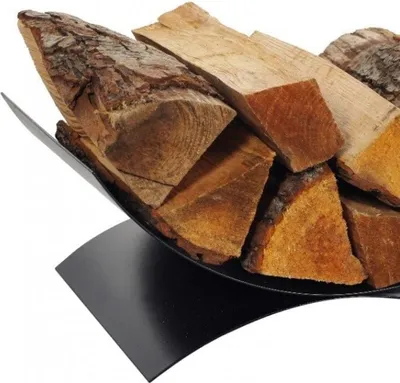 A close-up shot of firewood in a black metal log holder.
