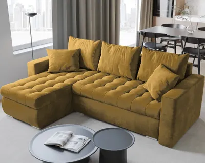A yellow sectional sofa is shown in a living room setting with a dining table and chairs in the background.