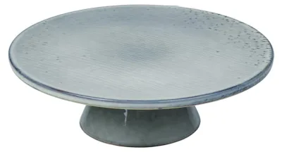 A cake stand with a textured surface and a pedestal base.