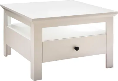 A white coffee table with a drawer and an open shelf.