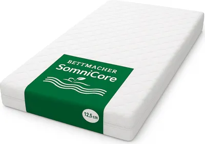 A white mattress with a green label showing brand information and product details.