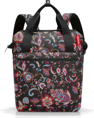 A black backpack with a colorful floral paisley pattern.