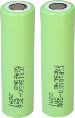 Two green cylindrical batteries are shown side-by-side against a white background.