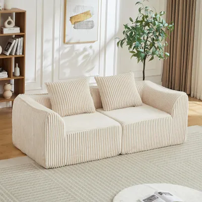 Image de Canapé en velours côtelé aux lignes courbes, avec un dossier en pente douce, livré avec 2 coussins, beige