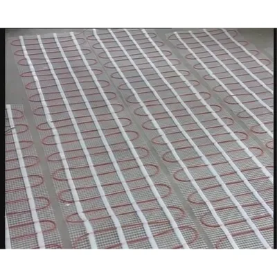 A close-up view of an underfloor heating mat laid out on a floor.
