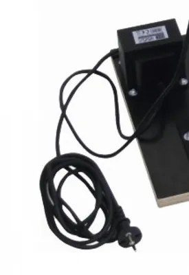 A close-up view of a black power supply cord and plug.