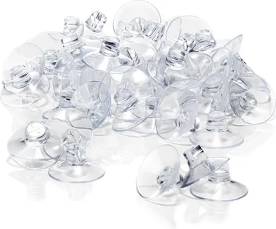 A pile of clear suction cups on a white background.