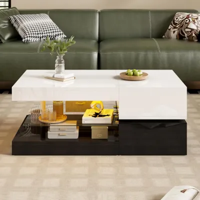 A modern living room scene with a green leather sofa and a white and black high-gloss coffee table.
