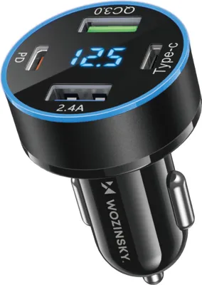 A close-up studio shot of a car charger with multiple ports and a digital display.