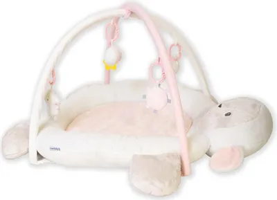 A baby play mat shaped like a sheep with arches and hanging toys.