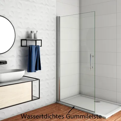 A modern bathroom with a sink, vanity, and a glass shower door.
