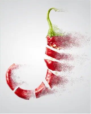 Produktbild von Wallario Poster - Chilischote löst sich in Pulver auf, Kunstdruck Größe: 40 x 50 cm