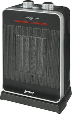A black and silver electric heater with a mesh front and two control knobs on top.