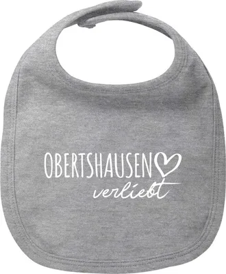 Produktbild von Huuraa Baby Lätzchen Obertshausen verliebt Heather Grey Klettverschluss  Baumwolle Latz Geschenkidee