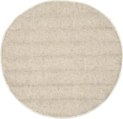 A round, beige cushion with horizontal stitching.