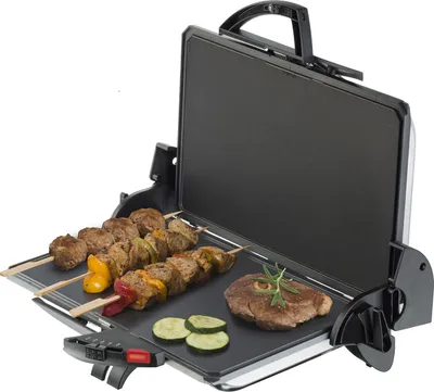 An open electric grill with food cooking on it.