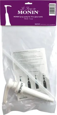 A Monin syrup pump packaged in a clear plastic bag, with the brand's purple header card visible.