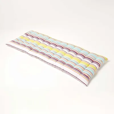 A striped bench cushion on a white background.