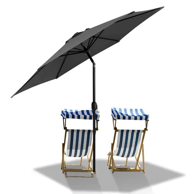 A gray patio umbrella is shown open, casting a shadow over two striped beach chairs.
