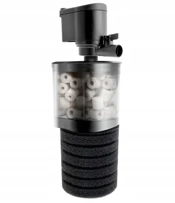 A black and clear aquarium filter with white ceramic rings inside, set against a white background.