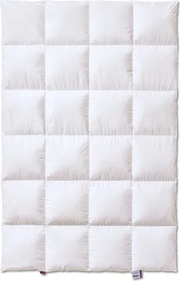 A white quilted comforter is laid flat on a white background.