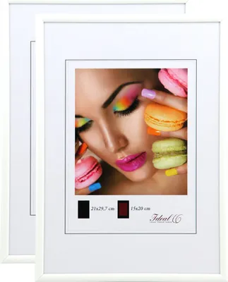 A collage of a woman's face with colorful makeup and macarons, presented within a white picture frame.