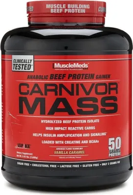 A black and red tub of MuscleMeds Carnivor Mass protein gainer.