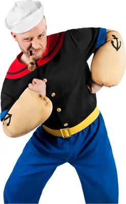 A man dressed as Popeye the sailor, posing with his fists up and a pipe in his mouth.