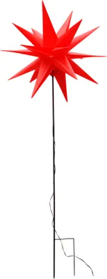 A red star-shaped garden stake with a light.