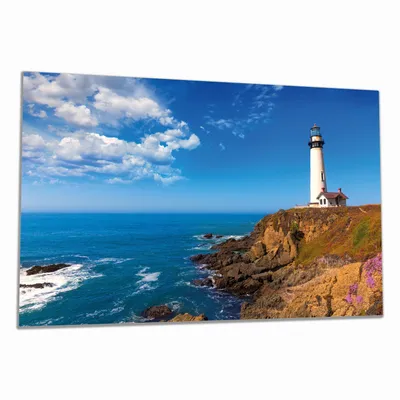 Produktbild von Wallario Herdabdeckplatte aus Glas, Größe 80 x 52 cm 1-teilig, Motiv Leuchtturm auf einem Felsvorsprung - Blauer Himmel