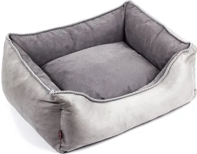 A gray dog bed is shown against a white background.