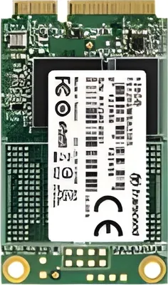 A top-down view of a green circuit board with a white label in the center.