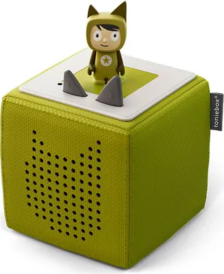 A green Toniebox with a character figurine on top, set against a white background.
