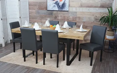 A dining room set with a wooden table and six chairs.