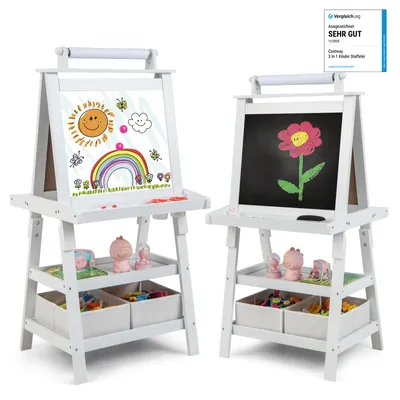 Two white wooden easels for children, each with a drawing surface and storage shelves below, are shown against a white background. The easel on the left has a drawing of a sun, rainbow, and clouds on its whiteboard surface. The easel on the right has a dra