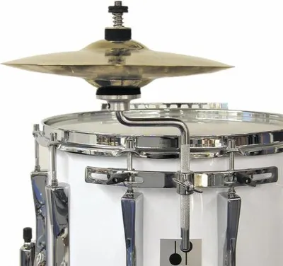 A close-up view of a cymbal holder attached to a snare drum.