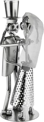 A metallic sculpture of a bride and groom in wedding attire.