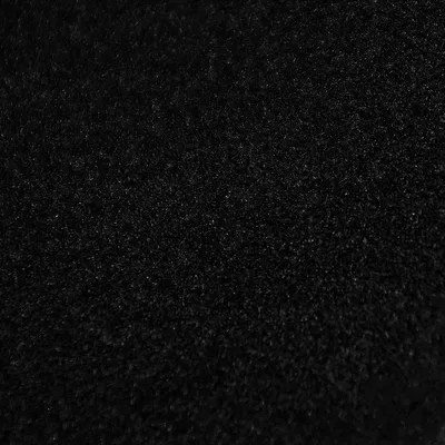 A close-up, textured view of black velvet fabric.