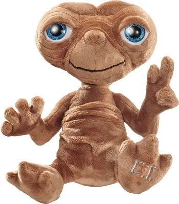 A plush toy of E.T. the Extra-Terrestrial is sitting and posing.