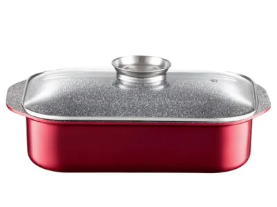 A red roasting pan with a speckled gray interior and a clear glass lid with a silver handle, presented on a white background.