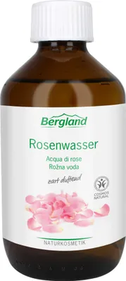 Produktbild von Bergland Rosenwasser duftet zart nach frischer Rosenblüte. Es erfrischt, reinigt und kühlt und empfiehlt sich ganz besonders als Gesichtswasser und für Kompressen. Rosenwasser ist auch eine bewährte Grundlage für die Herstellung eigener Emulsionen. 250 ml