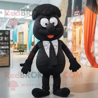 Image de Mascotte REDBROKOLY de personnage Moussaka noir habillé d'une barboteuse et de noeuds papillon