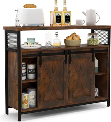 A rustic-style buffet cabinet with sliding doors and open shelving, displayed in a studio setting with various kitchen items.